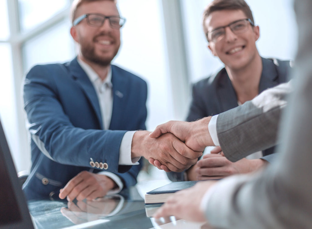 businessmen shaking hands with an business insurance agent in belleville illinois