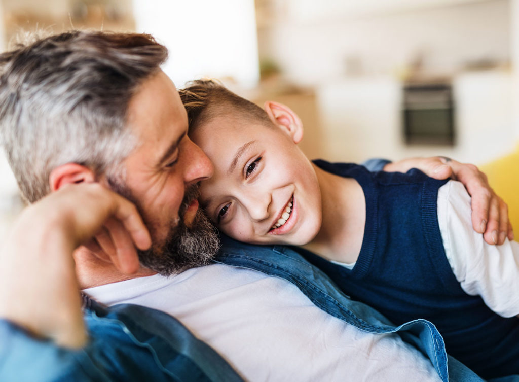 dad hanging out with his son, comforted by the fact his family is protected with his life insurance policy glen carbon il