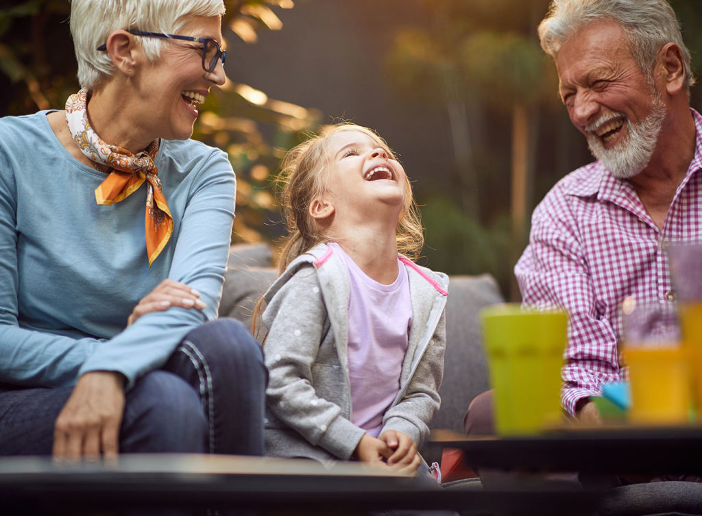 grandparents with excellent health insurance enjoying time with their granddaughter in maryville illinois